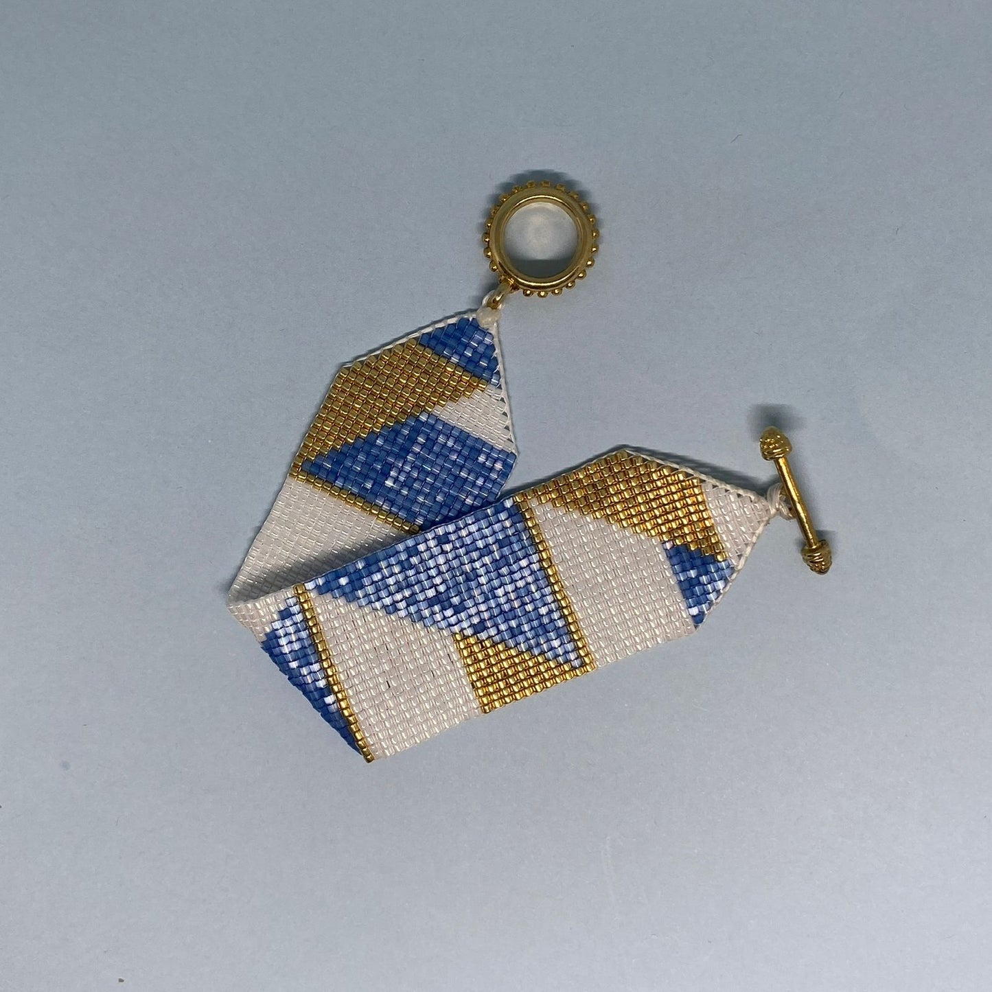 Conjunto Aretes Centauri y Pulsera Azul Escamas