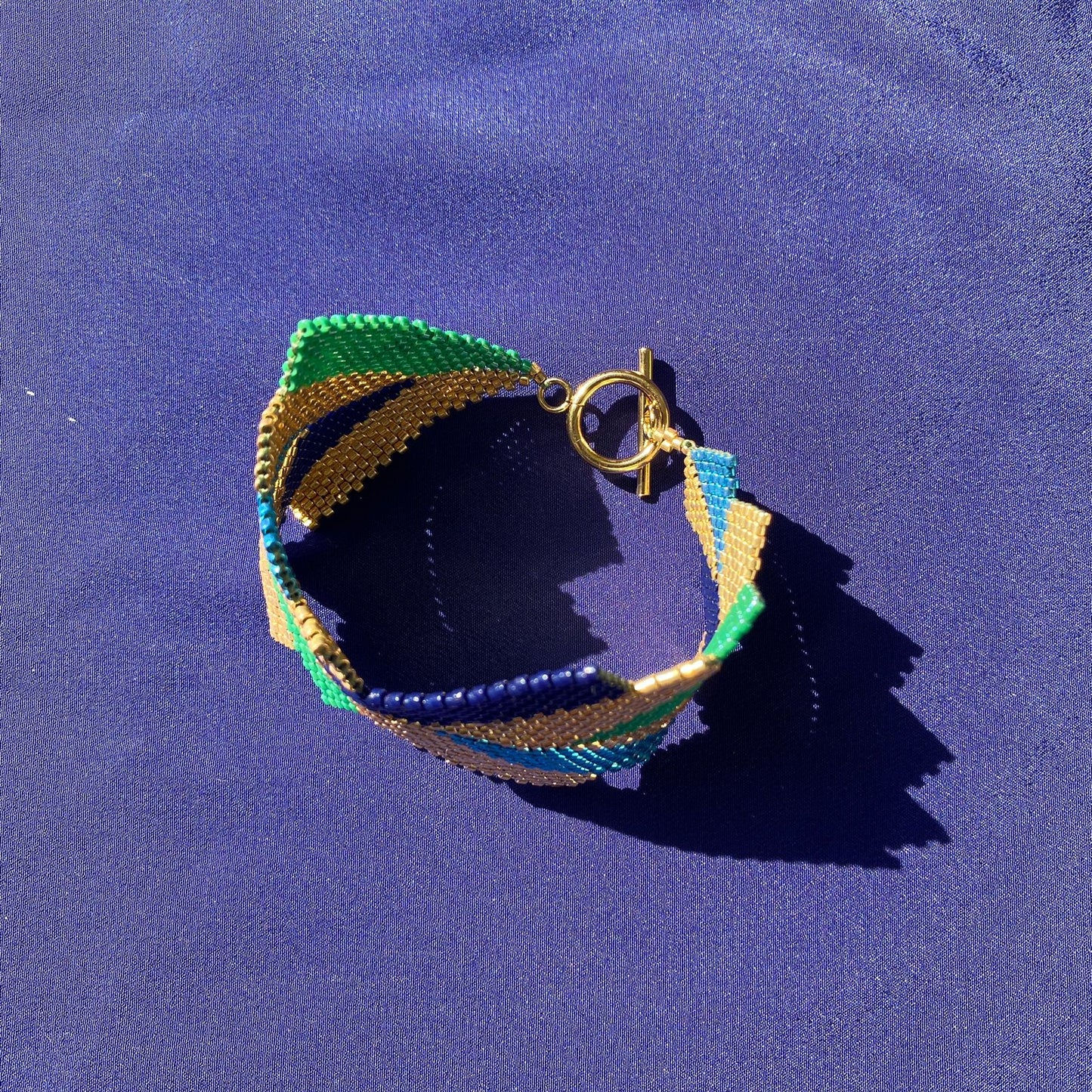 Brazalete Capella Pavo Real - Asimétrico