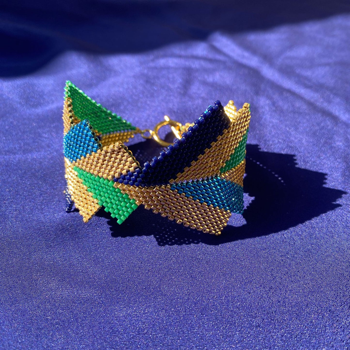 Brazalete Capella Pavo Real - Asimétrico
