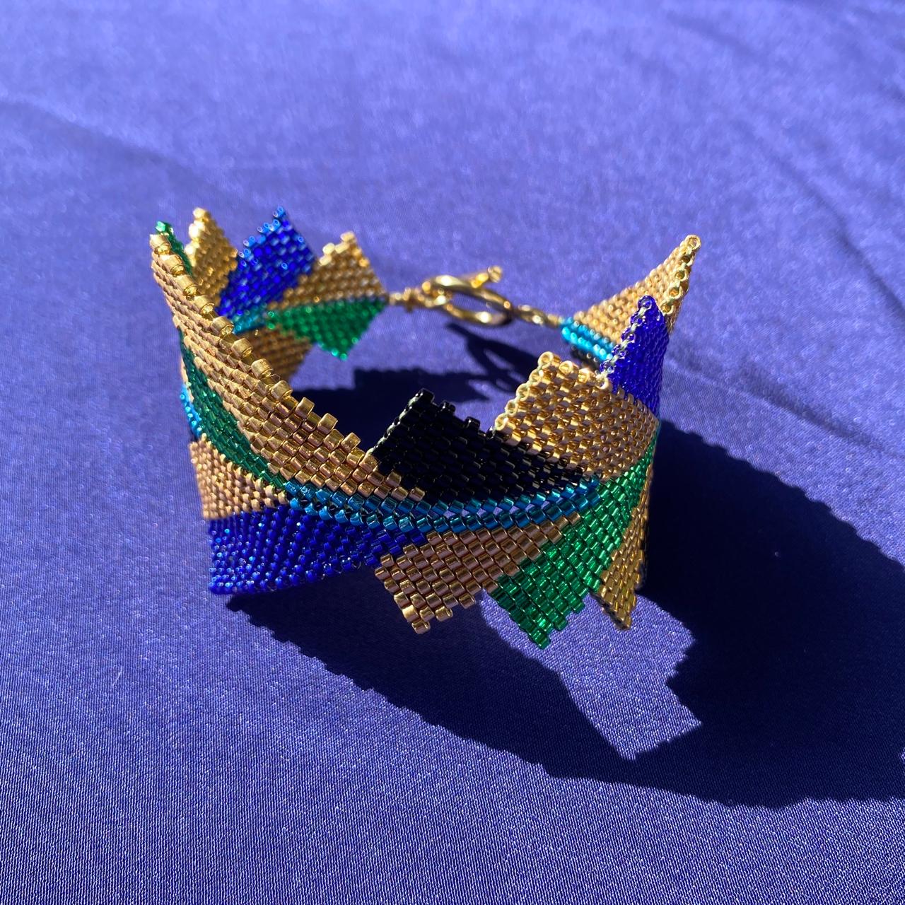 Brazalete Capella Pavo Real - Asimétrico