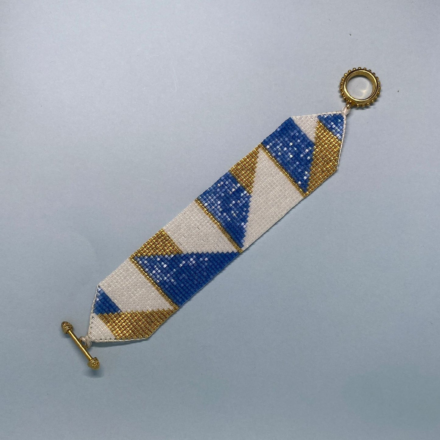 Conjunto Aretes Centauri y Pulsera Azul Escamas