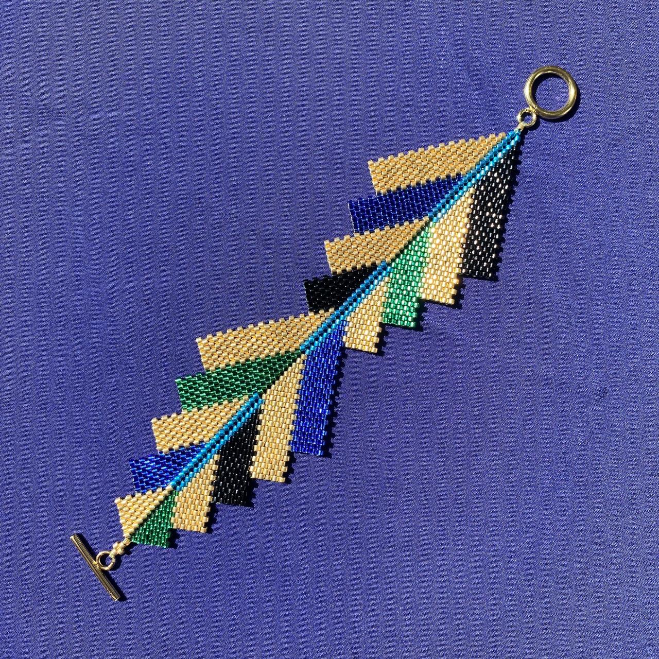 Brazalete Capella Pavo Real - Asimétrico