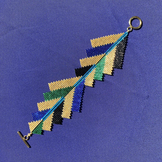 Brazalete Capella Pavo Real - Asimétrico